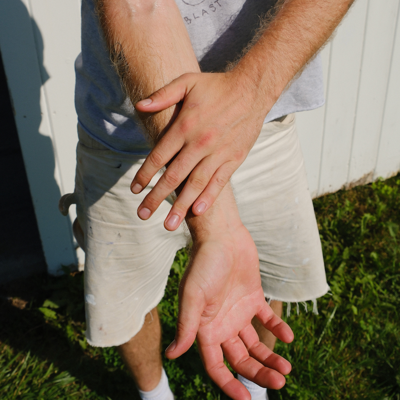 Body Oil, Organic hydrating being applied to a males arm outside