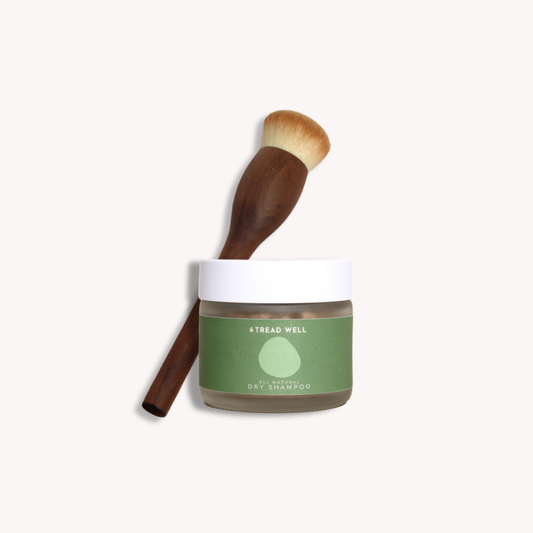 Tread Well dry shampoo with brush on a white background