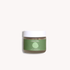Jar of dry shampoo with a green label on a white background
