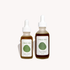 Two bottles of 'Tread Well' skincare products on a white background
