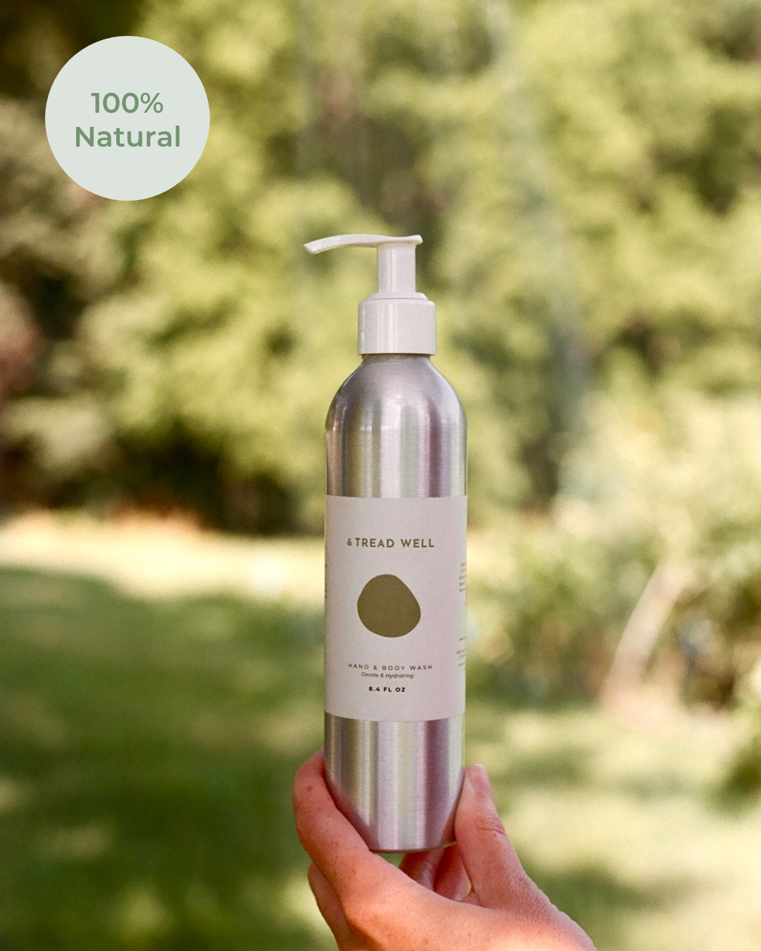Hand holding a bottle labeled 'Tread Well' with a natural background