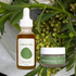 Tread Well skincare products with a dropper bottle and jar on a green leafy background