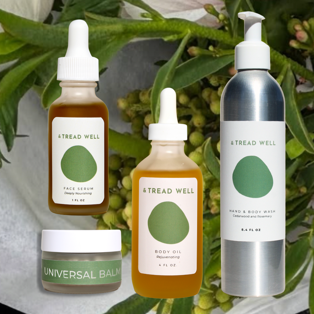 Collection of Tread Well skincare products with greenery in the background