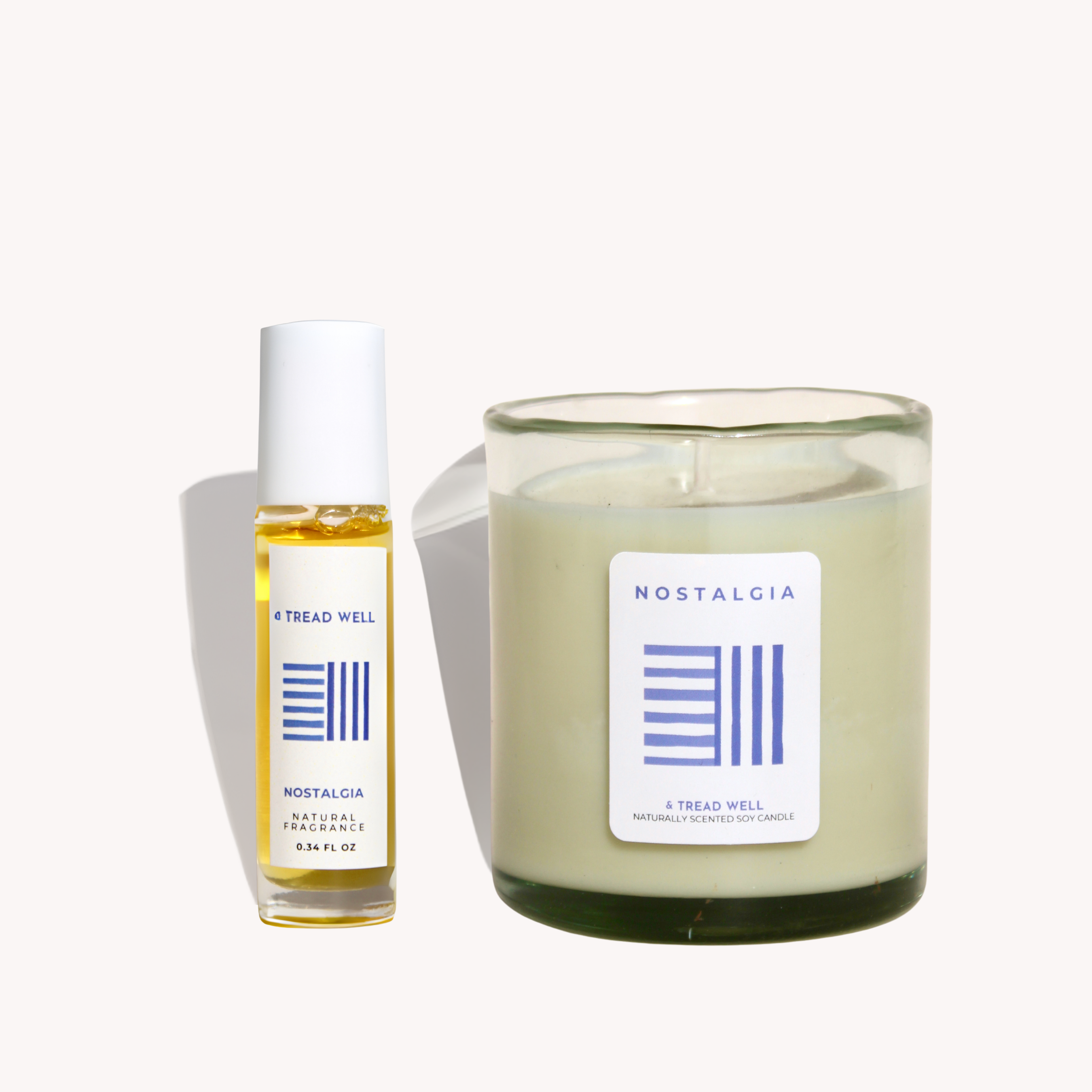 A bottle and a candle with 'Nostalgia' label on a white background